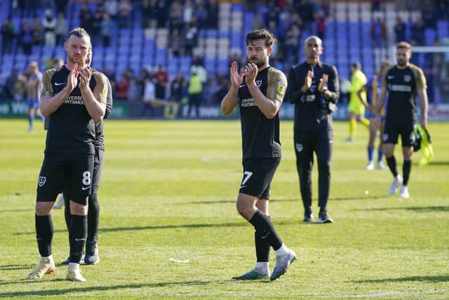 Ryan Tunnicliffe and Joe Rafferty applaud travelling Pompey fans after a disappointing result at Shrewsbury. Picture: Jason Brown/ProSportsImages