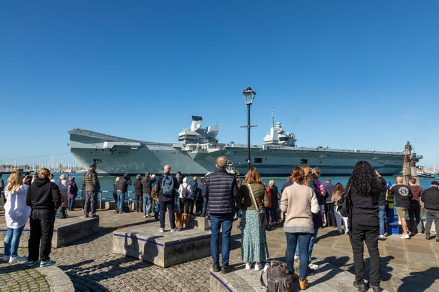 Onlookers at the Point watching HMS Prince Of Wales being deployed. Picture: Mike Cooter (280924)