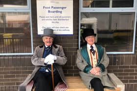 Taking a seat before boarding the ferry - two David Copperfield cast members