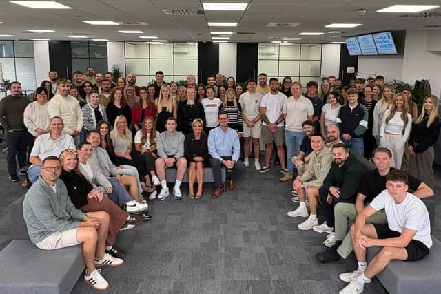 Amanda Martin MP, (centre front) pictured with the team at Carrington West