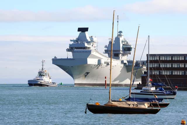 HMS Queen Elizabeth returning in Portsmouth on Thursday, October 13.

Picture: Sarah Standing (131022-1367)