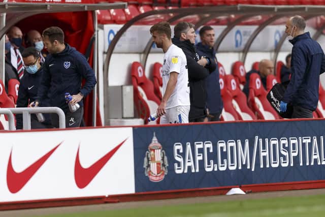 Michael Jacobs goes off injured during Pompey's trip to Sunderland last October.