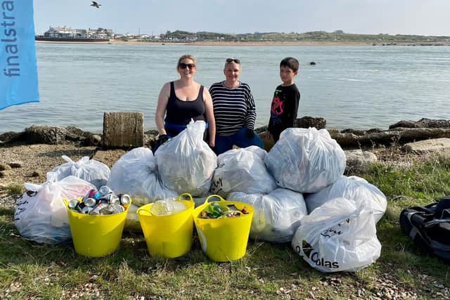 Final Straw Foundation members Georgie Smith, Zoe Bentley, and Zoe's son Matt at Eastney beach on October 9, 2021