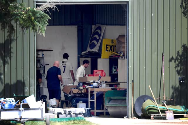 John Simpson and Tom Helm of Middlesex attempt to find the ball in the groundsman's shelter on the final day of the Bob Willis Trophy tie at Radlett. Photo by Alex Davidson/Getty Images.