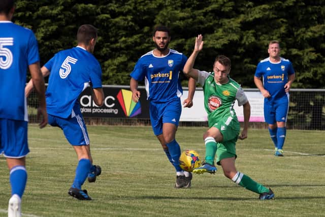 Ryan Pennery (green) in action for Moneyfields in an FA Cup tie against Reading City in August 2019.
Picture: Duncan Shepherd