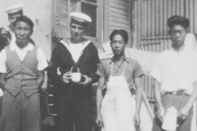 Former boy seaman Frank Olford in Wel-I-Wei, China, taking tea with the locals, 1934. Picture: Ted Saunders