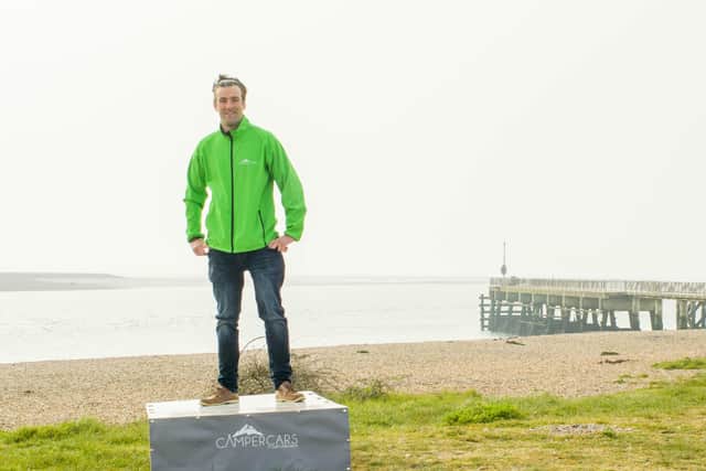 Jordan Boon, from Southsea, with the CamperCars system box. PIcture by Mike Woods at Solent Sky Services.