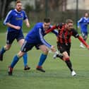 Nathan Gray (red/black), pictured in action for Fleetlands last season, struck a rapid hat-trick as Paulsgrove suffered their heaviest defeat for seven years at Bush Hill in the semi-finals of the L4 Teamwear Challenge Cup. Picture: Keith Woodland