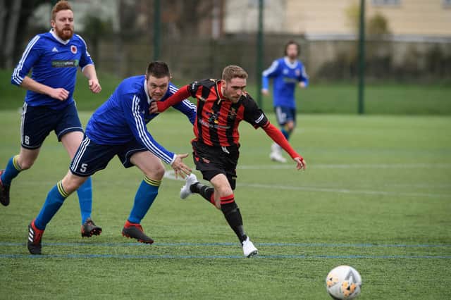 Nathan Gray (red/black), pictured in action for Fleetlands last season, struck a rapid hat-trick as Paulsgrove suffered their heaviest defeat for seven years at Bush Hill in the semi-finals of the L4 Teamwear Challenge Cup. Picture: Keith Woodland