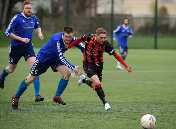 Nathan Gray (red/black), pictured in action for Fleetlands last season, struck a rapid hat-trick as Paulsgrove suffered their heaviest defeat for seven years at Bush Hill in the semi-finals of the L4 Teamwear Challenge Cup. Picture: Keith Woodland