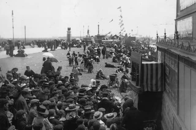 Crowds watching a Punch and Judy show at Southsea, about 1895. Picture: Hulton Archive/Getty Images.