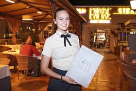 Francesca Lucas, 26 from Waterlooville, has shared her experiences of living in Tenerife during lockdown. Pictured: Francesca at her job in a restaurant in Las Americas