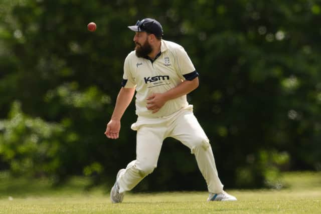 A Hayling fielder keeps his eye on the ball. Picture: Keith Woodland