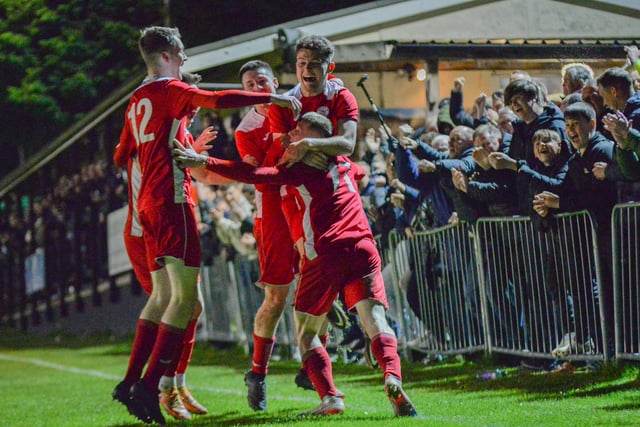 Horndean players celebrate Zack Willett's stoppage time winner. Picture by Martyn White