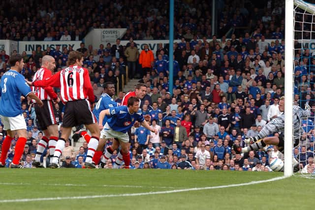 Arjan De Zeeuw scores Pompey's second goal in the 4-1 victory over Southampton in April 2005