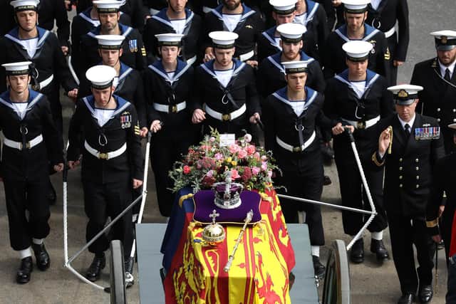 The State Gun Carriage, which was pulled by 142 Naval Ratings carrying the coffin of Her Majesty Queen Elizabeth II moves along the Procession route, up Constitution Hill.