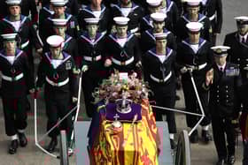 The State Gun Carriage, which was pulled by 142 Naval Ratings carrying the coffin of Her Majesty Queen Elizabeth II moves along the Procession route, up Constitution Hill.