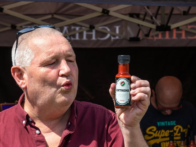 A moment of regret from Phil Martin after sampling the Extreme Chilli Sauce from the Dorset Chilli Shop from Bournemouth. Picture: Mike Cooter (210522)