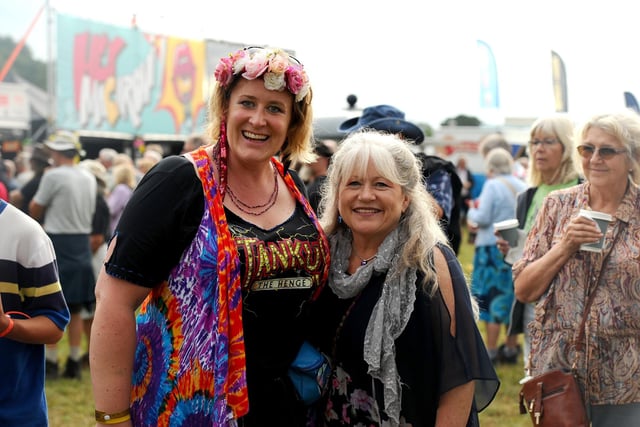 Emma and Claire, from Gosport, didn't let the rain dampen their spirits at Wickham Festival. Picture: Sarah Standing (310725-1229)