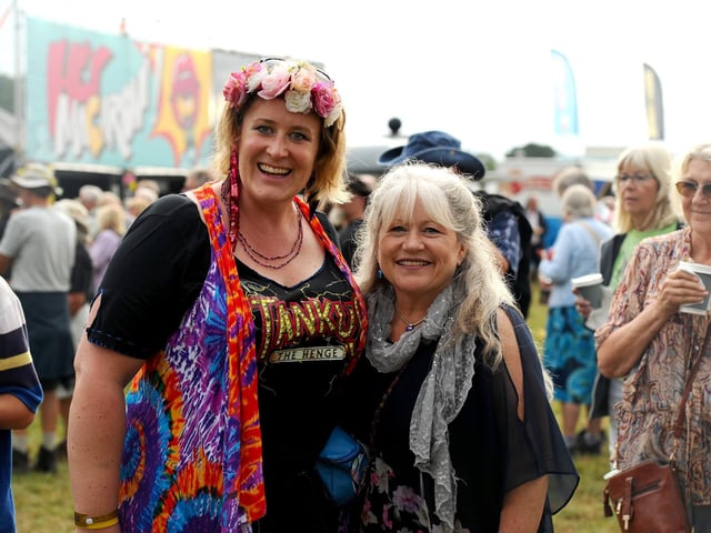 Emma and Claire, from Gosport, didn't let the rain dampen their spirits at Wickham Festival.  Picture: Sarah Standing (310725-1229)