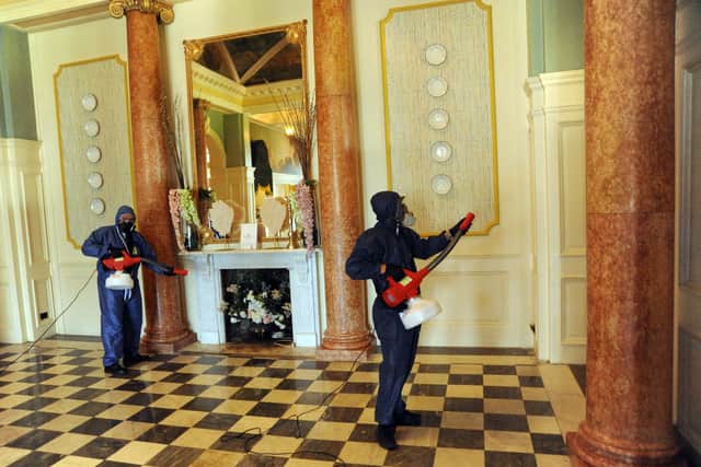 Harrison Hart (right) alongside father, Tim Hart, carrying out the disinfecting fogging process in The Queens Hotel in Southsea.