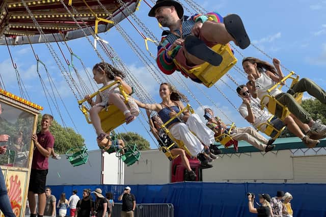 People enjoy a fairground ride at the Victorious Festival in Southsea. The smaller rides are free, with larger ones available at a price
Picture: Ben Mitchell/PA Wire