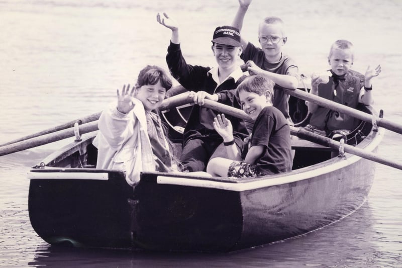 Sea scout Jonathan Coupe takes the strain on the oars as he gives a guided trip around Fareham Creek in July 1993. The News PP4065