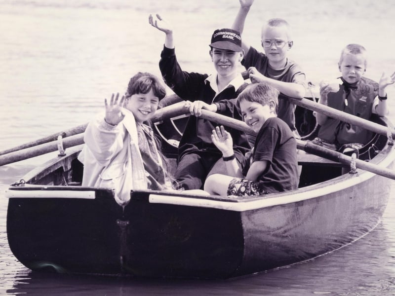 Sea scout Jonathan Coupe takes the strain on the oars as he gives a guided trip around Fareham Creek in July 1993. The News PP4065