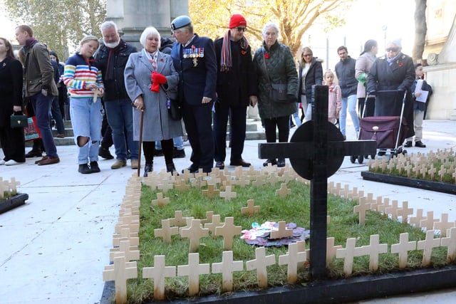 The public look at crosses. Armistice Day Service, World War I Cenotaph, Guildhall Square, Portsmouth
Picture: Chris Moorhouse (jpns 111123-32)