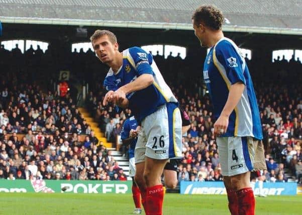 Gary O'Neil celebrates scoring one of his two goals against Fulham in April 2006, using a golfing theme