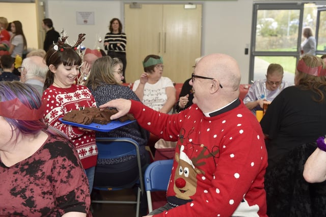 Beacon View Primary Academy in Paulsgrove held their annual community Christmas lunch on Friday, December 22.

Pictured is: Scarlett Muscat (11) handing out brownies.

Picture: Sarah Standing (221223-4042)