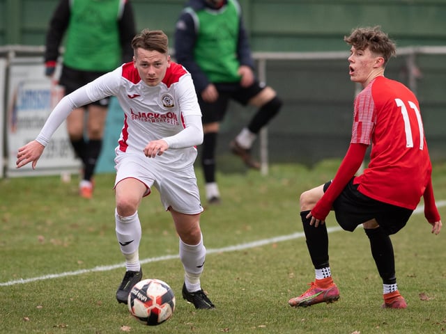 Horndean's Robbie Taw goes past Connor Underhill. Picture: Keith Woodland