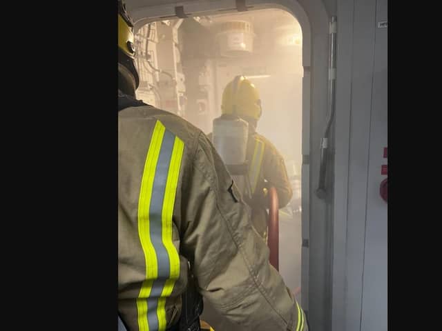 Crew tackling a firefighting training exercise onboard HMS Queen Elizabeth.
