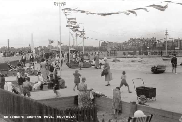 A windy day at the children's boating pool on Southsea Common. In the background you can see (from left) the obelisk of the naval war memorial, the power station chimney and the Queen's Hotel. The picture is undated but the fashions and the cars parked on the common indicate that we might be in the late 1920s or early 1930s. Picture: costen.co.uk