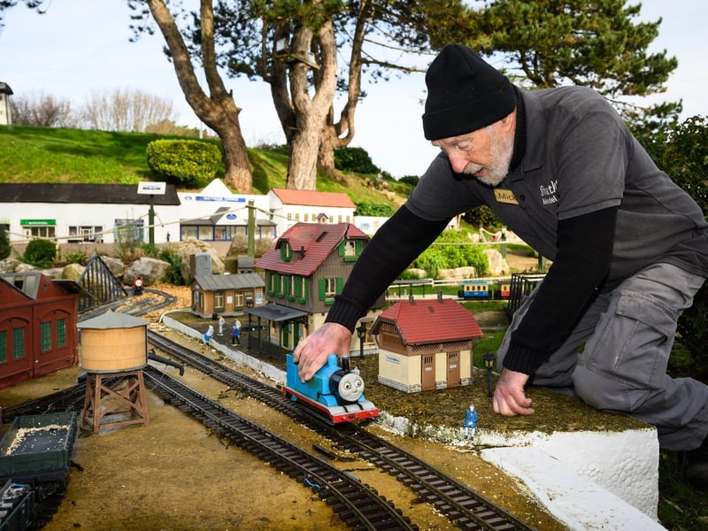 Pictured is: Mick Bright puts Thomas the Tank engine back on the rails.Picture: Keith Woodland (100221-20)