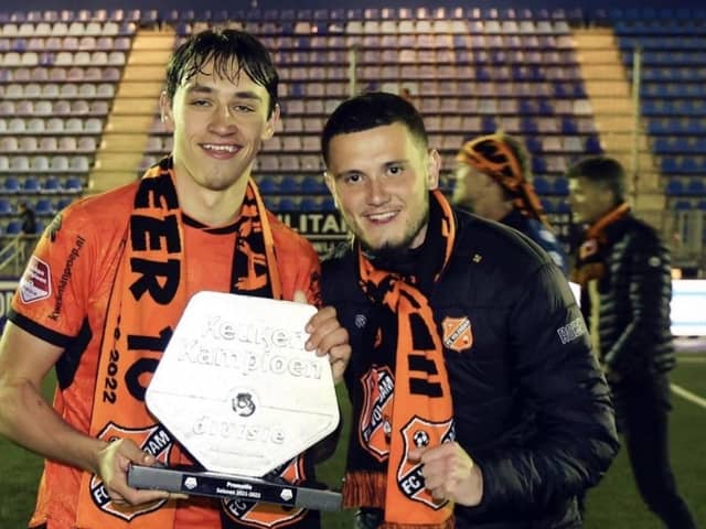 Josh Flint with former Pompey team-mate Leon Maloney (right) after securing promotion to the Eredivisie in April 2022, following a 2-1 triumph over Den Bosch.