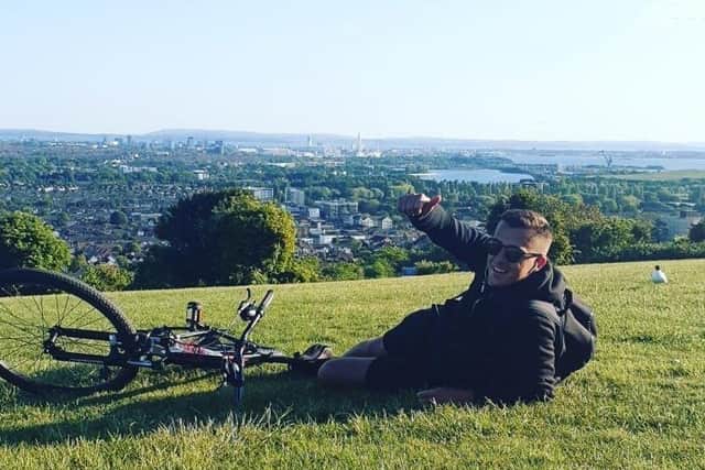 Luke King from Paulsgrove pictured at the end of his challenge overlooking Portsmouth on the top of Portsdown Hill.