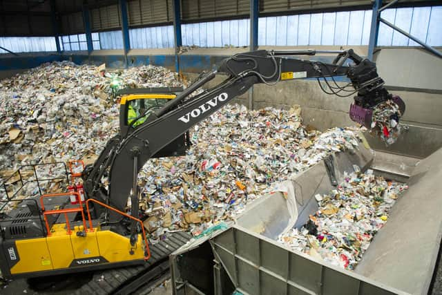 A crane moving assorted recyclable waste into the hopper. Picture: Habibur Rahman