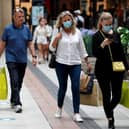 Shoppers wearing face masks in Gunwharf Quays, Portsmouth, after the shopping hub reopened last month. Photo: Adrian Dennis/AFP via Getty Images)