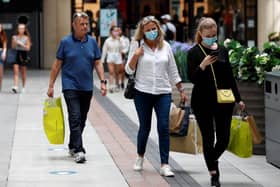 Shoppers wearing face masks in Gunwharf Quays, Portsmouth, after the shopping hub reopened last month. Photo: Adrian Dennis/AFP via Getty Images)
