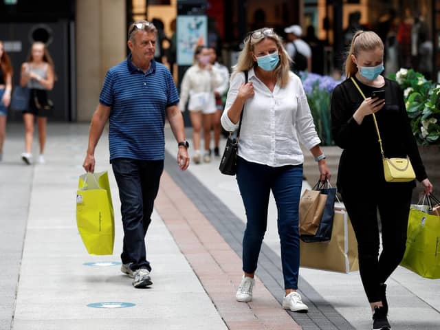 Shoppers wearing face masks in Gunwharf Quays, Portsmouth, after the shopping hub reopened last month. Photo: Adrian Dennis/AFP via Getty Images)