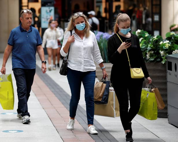 Shoppers wearing face masks in Gunwharf Quays, Portsmouth, after the shopping hub reopened last month. Photo: Adrian Dennis/AFP via Getty Images)