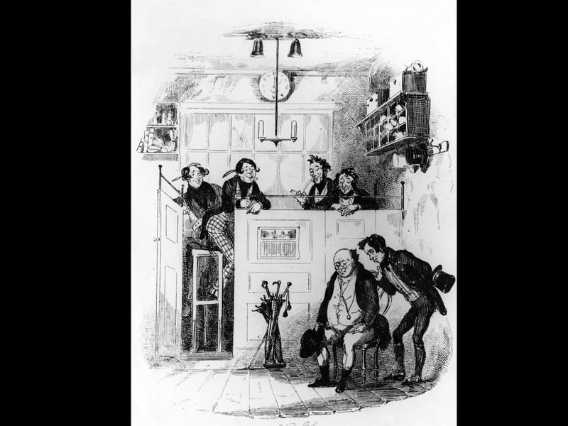 Samuel Pickwick (seated, right) with Sam Weller at the attorney's office in a scene from Charles Dickens's first novel 'The Pickwick Papers', published as a serial from 1836 to 1837. Illustration by Phiz (Hablot Knight Browne, 1815 - 1882). (Photo by Hulton Archive/Getty Images)