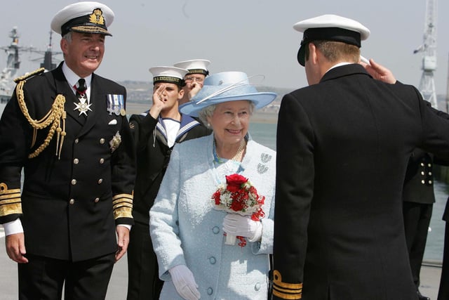 Britain's Queen Elizabeth II is greeted as she boards HMS  Endurance with Admiral Sir Alan West (left) in Portsmouth on her way to review the fleet, Tuesday June 28, 2005.  A total of 167 ships from the Royal Navy and 35 nations are taking part in the International Fleet Review at Spithead, off Portsmouth, as part of the Trafalgar 200 celebrations this week. Picture: Kirsty Wigglesworth/PA/WPA Rota