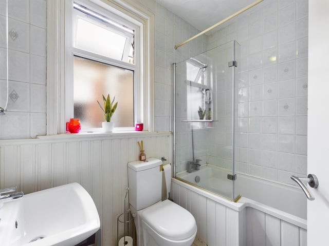 A downstairs toilet is neatly fitted into the space.