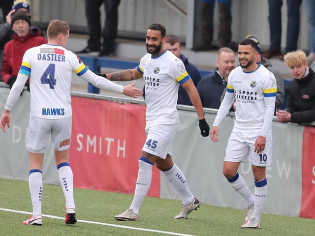 Joe Oastler, left, heads over to congratulate Stefan Payne after he doubled Hawks' advantage from the penalty spot Picture: Dave Haines