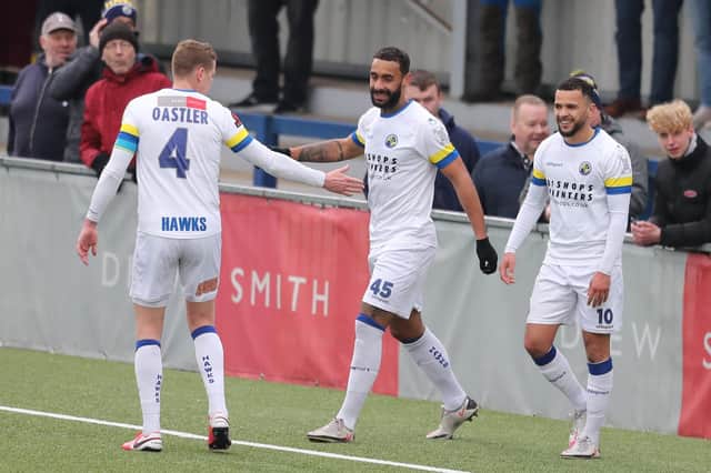 Joe Oastler, left, heads over to congratulate Stefan Payne after he doubled Hawks' advantage from the penalty spot Picture: Dave Haines