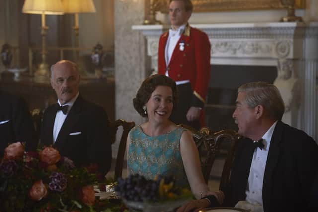 Olivia Colman, as The Queen, pictured in the State Dining Room at Belvoir Castle during filming of Netflix series The CrownPHOTO Des Willie / Netflix