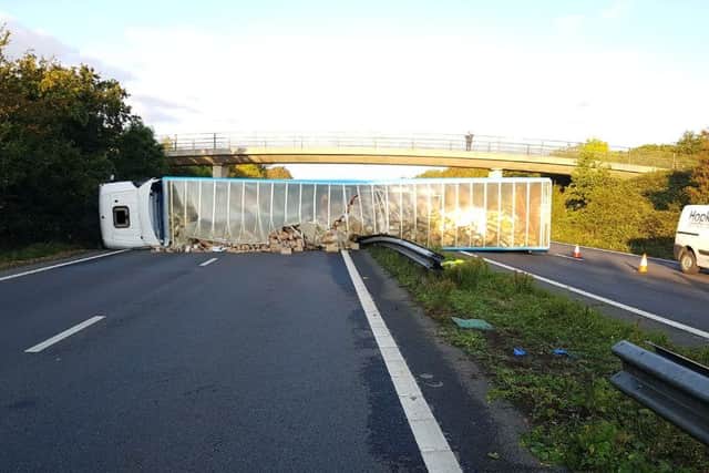A lorry driver who crashed and overturned his vehicle – spilling thousands of parcels onto the A27 – has been jailed. Picture: Sussex Constabulary.
