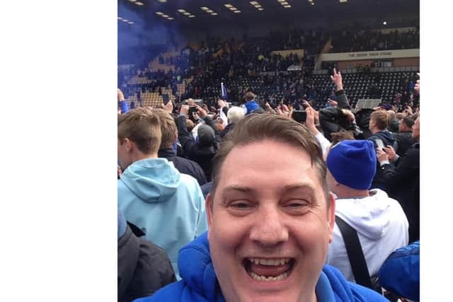 Nigel Davis, a huge Portsmouth FC fan, celebrating the Blues' promotion to League One. Picture: Supplied